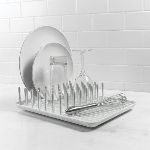 OXO Good Grips compact dish rack in-use on countertop for plate drying