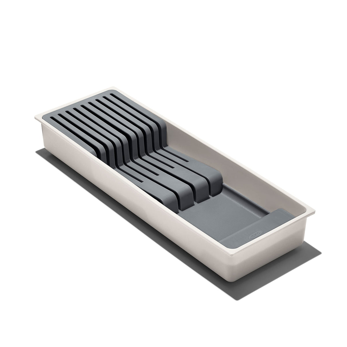 OXO Good Grips compact knife drawer organizer in a drawer for safe storage.