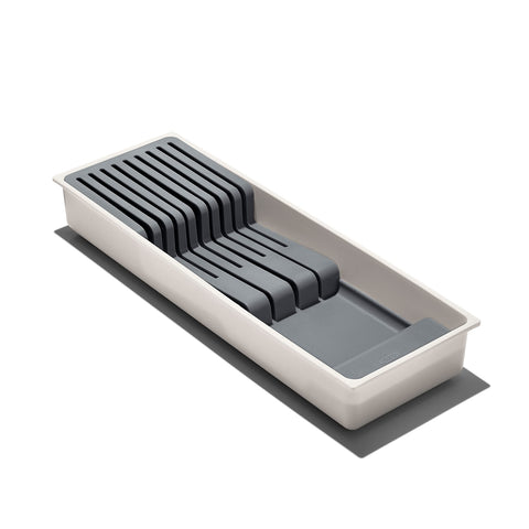 OXO Good Grips compact knife drawer organizer in a drawer for safe storage.