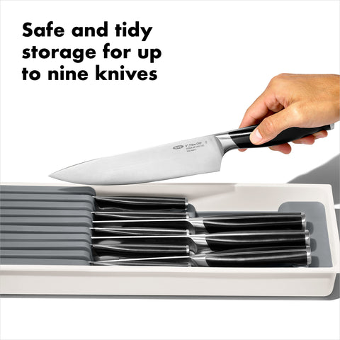 OXO Good Grips compact knife drawer organizer highlighting four large knife slots for organization.