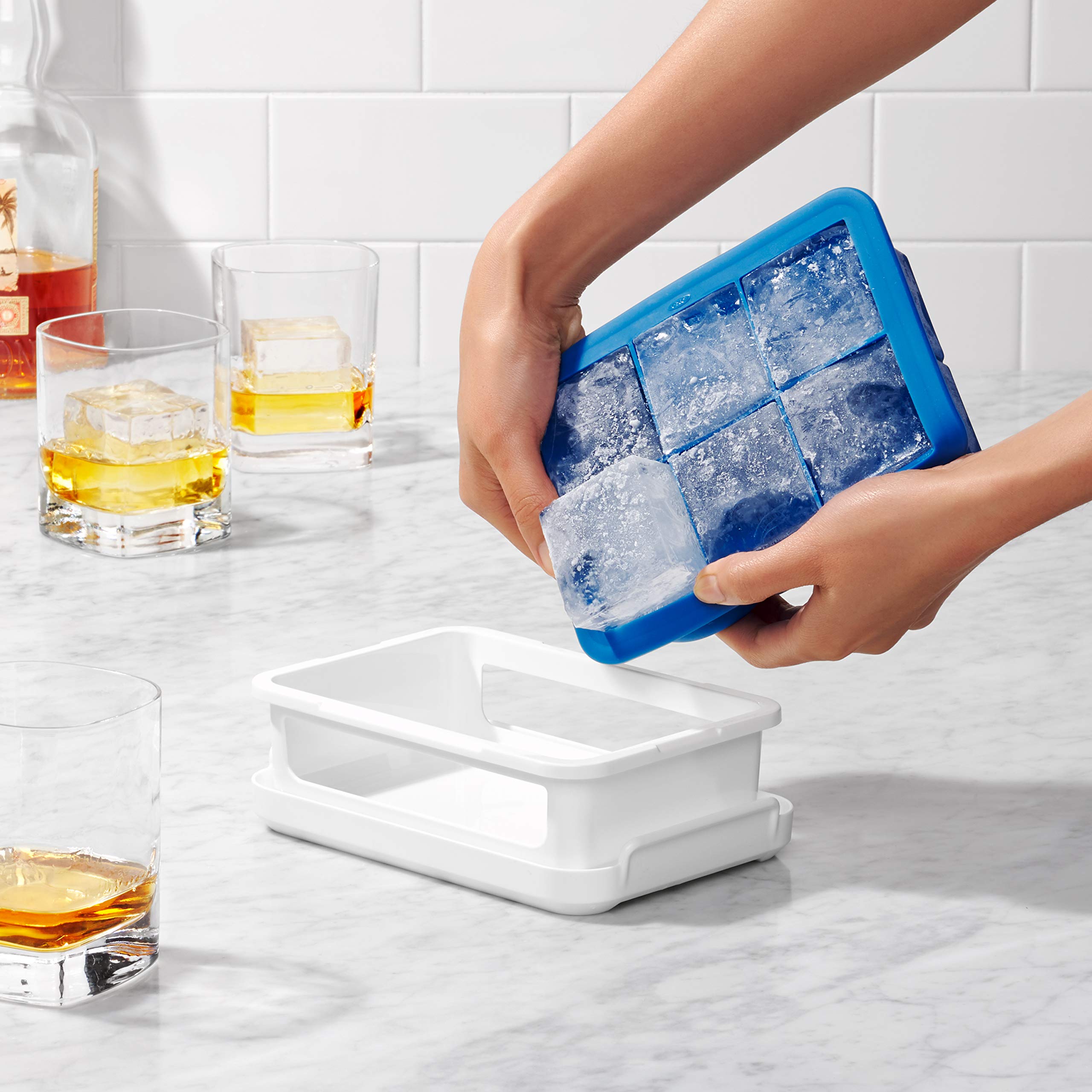 OXO Good Grips lid on dark blue ice tray enabling stacking