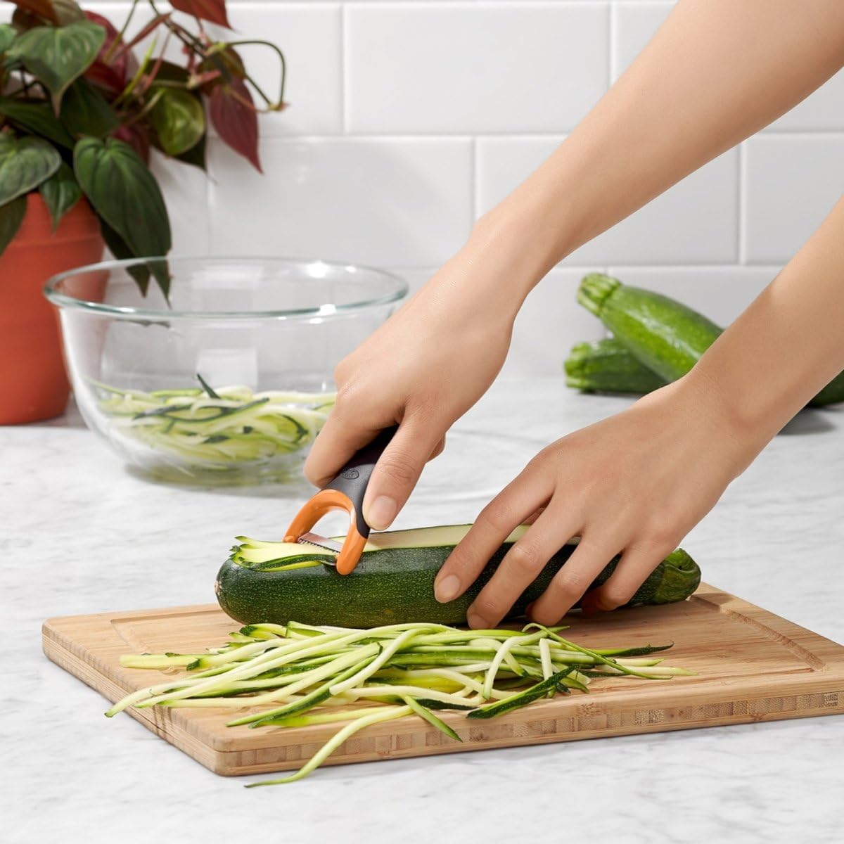 OXO Good Grips ergonomic handle close-up emphasizing non-slip grip.