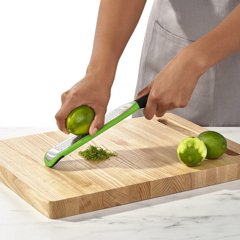 OXO Good Grips etched zester handles ginger with fine shavings easily.