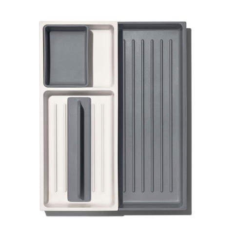 OXO Good Grips expandable drawer organizer designed to organize cluttered kitchen drawers