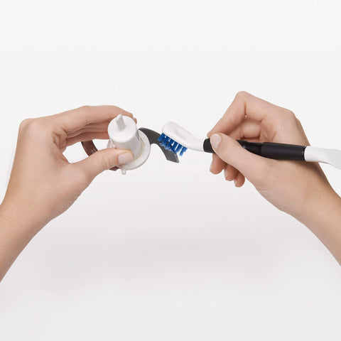 OXO Good Grips angled brush clean fixtures and surfaces with ease