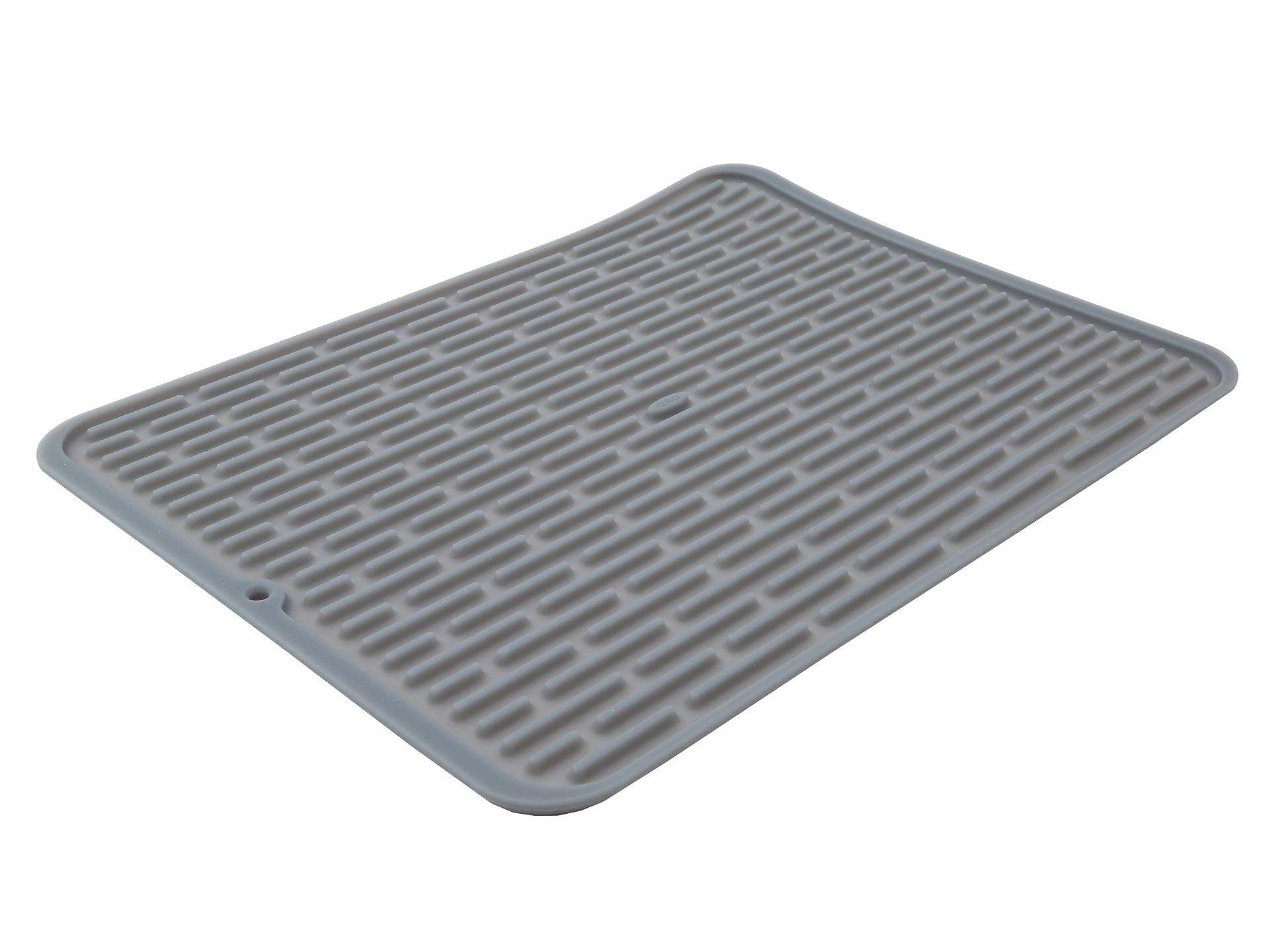 OXO Good Grips large silicone drying mat laid flat for air drying large pans and bowls.