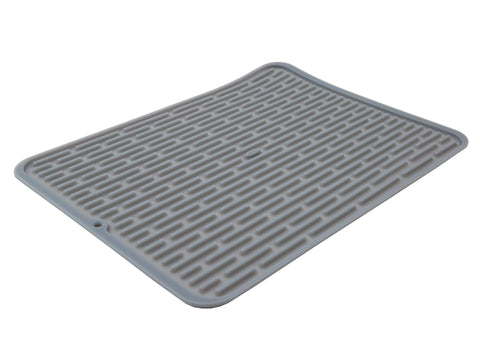 OXO Good Grips large silicone drying mat laid flat for air drying large pans and bowls.