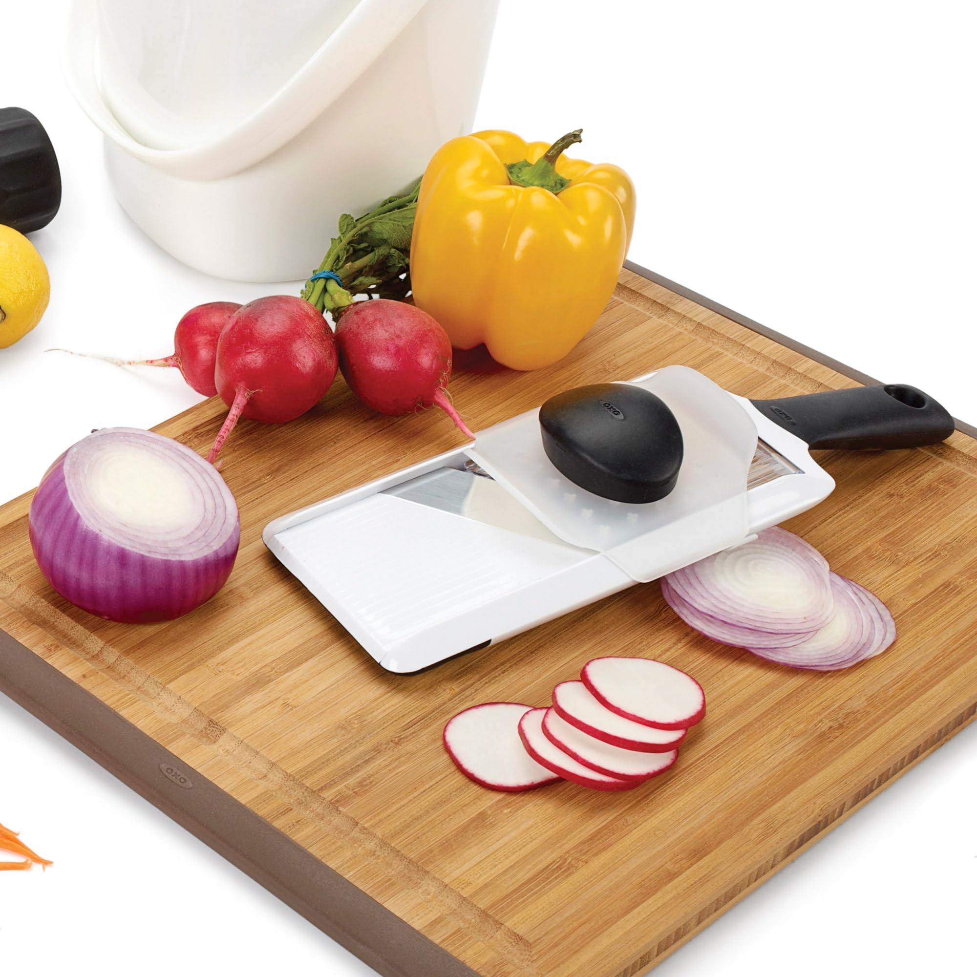 Protective food holder on OXO mandoline keeps fingers safe