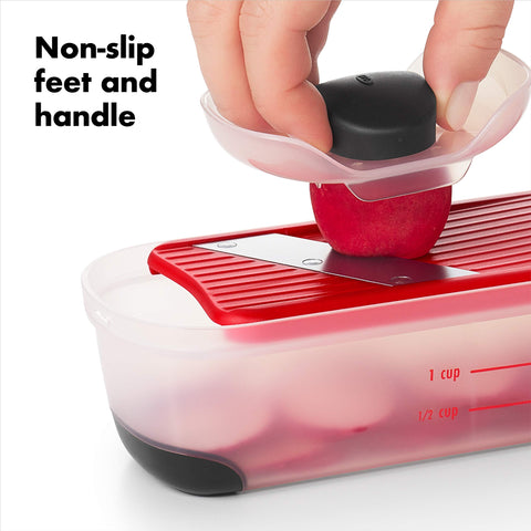 OXO Good Grips Mini Grate & Slice Set food holder protects hands during slicing.