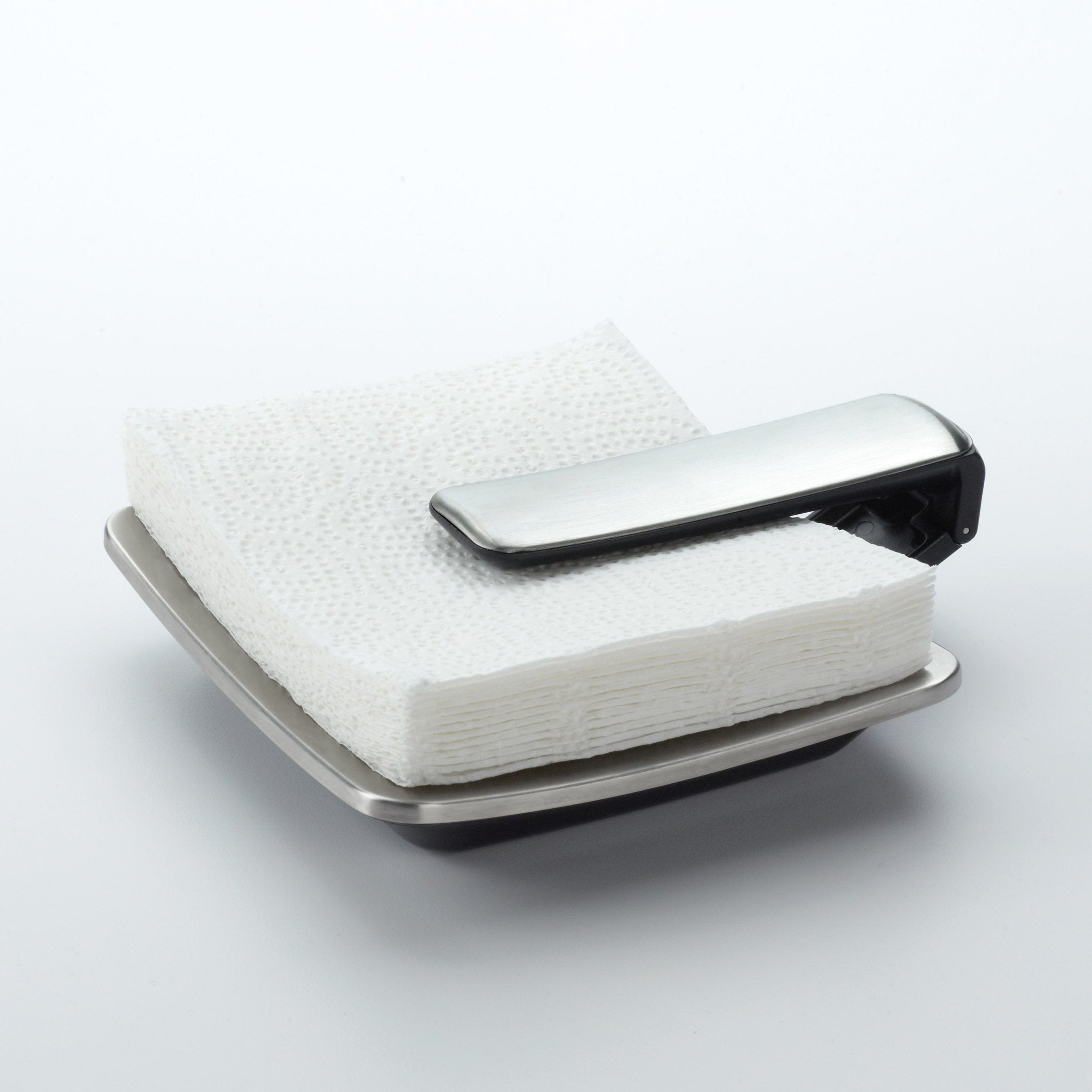 OXO Good Grips napkin holder arm weighted to hold napkins securely during meals