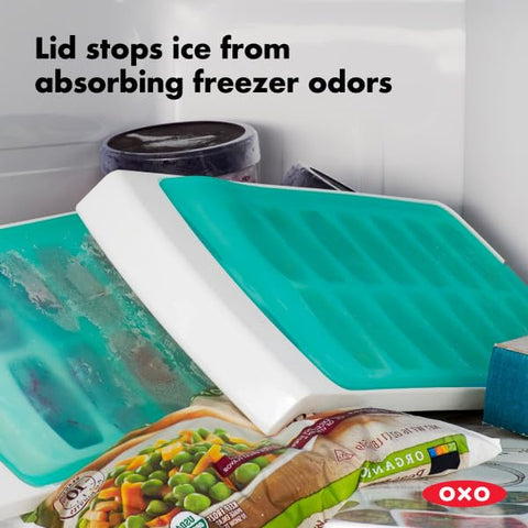 OXO Good Grips No-Spill Tray held by a comfortable handle during filling.