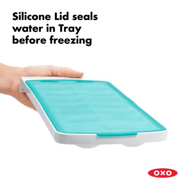 OXO Good Grips No-Spill tray shows lid being pressed to seal.