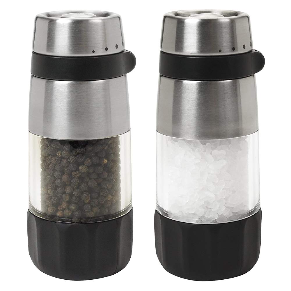 OXO Good Grips salt and pepper grinders, top view showing sleek stainless steel finish and clear bodies.