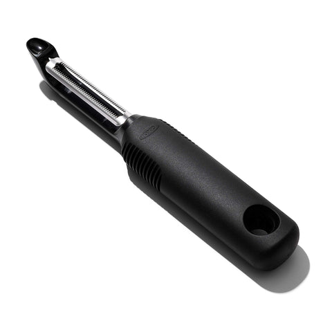 OXO Good Grips Serrated Peeler blade close-up, showing sharp serration for effortless peeling.