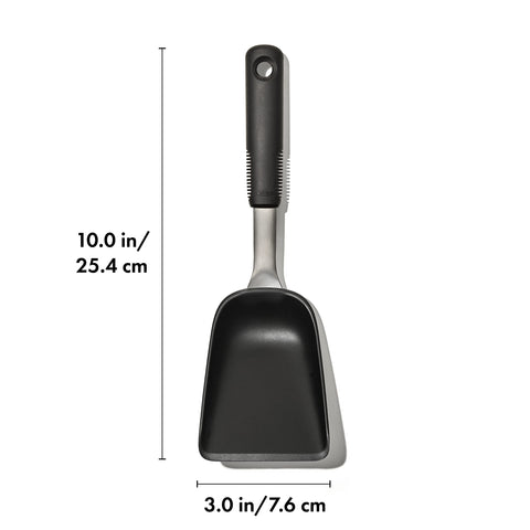 OXO Good Grips Sheet Pan Scoop shows tapered walls to keep food in place during serving.