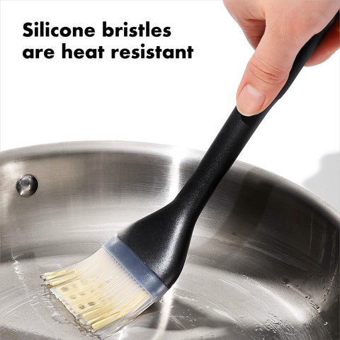 OXO Good Grips Silicone Basting Brush angled head keeps bristles off counters for mess-free prep.