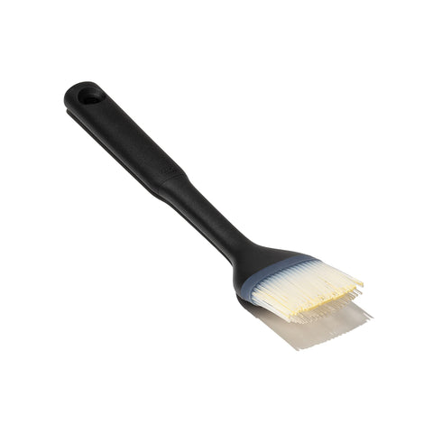 OXO Good Grips Silicone Basting Brush center-hole bristles for efficient sauce transfer.