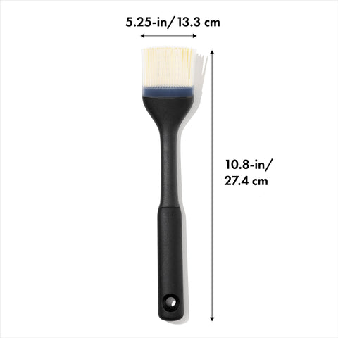 OXO Good Grips Silicone Basting Brush holds liquids for even basting.