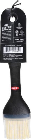 OXO Good Grips silicone basting brush small angled-head keeps bristles off countertop.