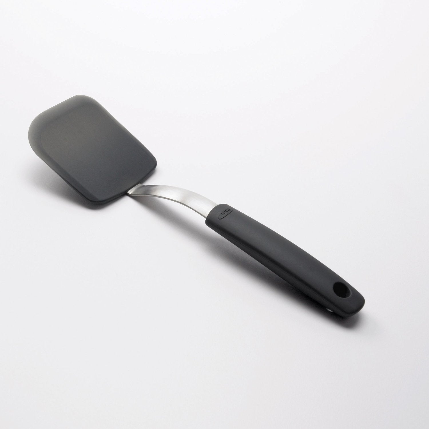 OXO Good Grips silicone cookie spatula features an angled handle to keep hands away from hot foods.