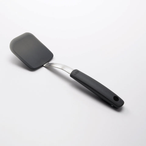 OXO Good Grips silicone cookie spatula features an angled handle to keep hands away from hot foods.