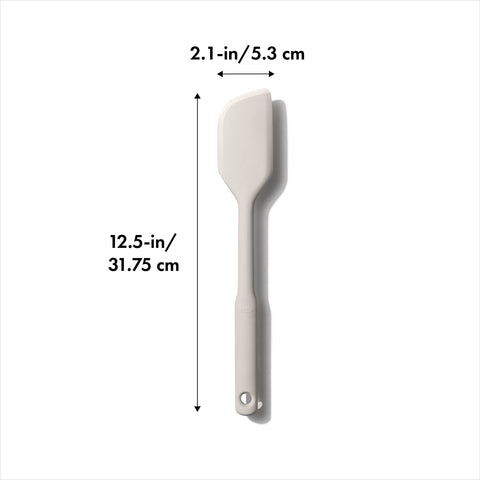 OXO Good Grips silicone spatula ideal for batter and mixing.