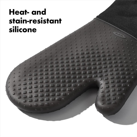 OXO Good Grips silicone oven mitt black, easy cleaning after cooking.
