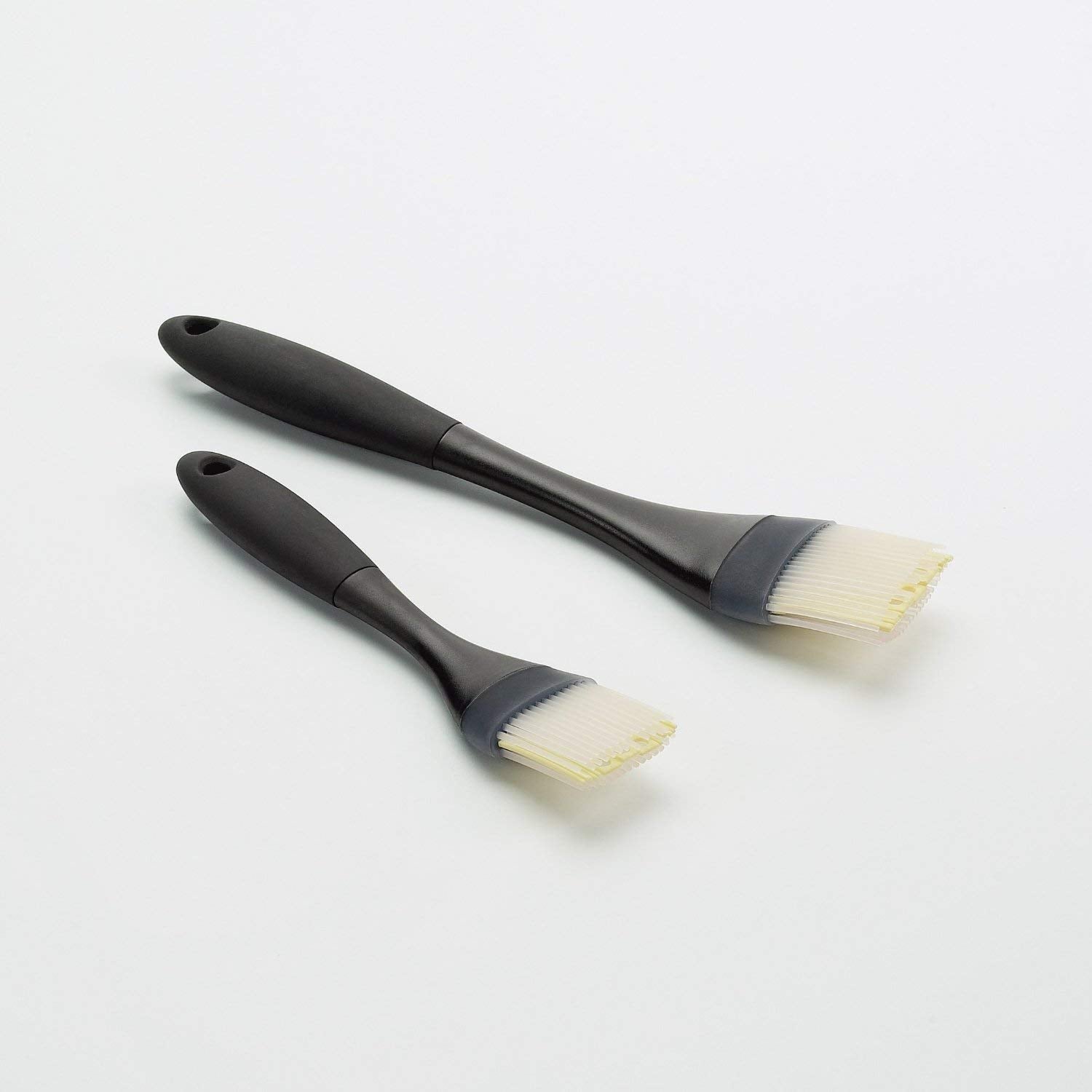 OXO silicone brush center gaps hold liquid during transfer.