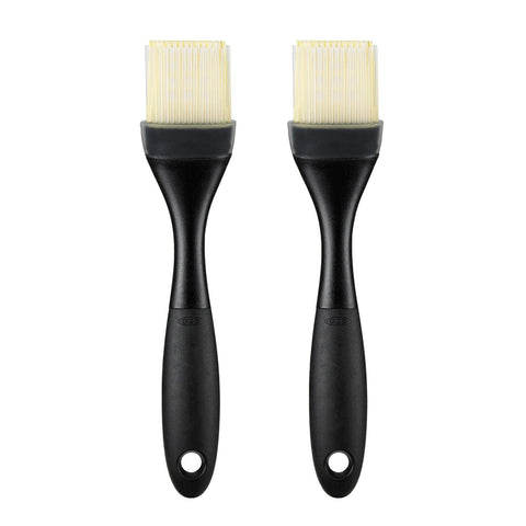 OXO Good Grips silicone pastry brush with angled head for tidy countertop use.