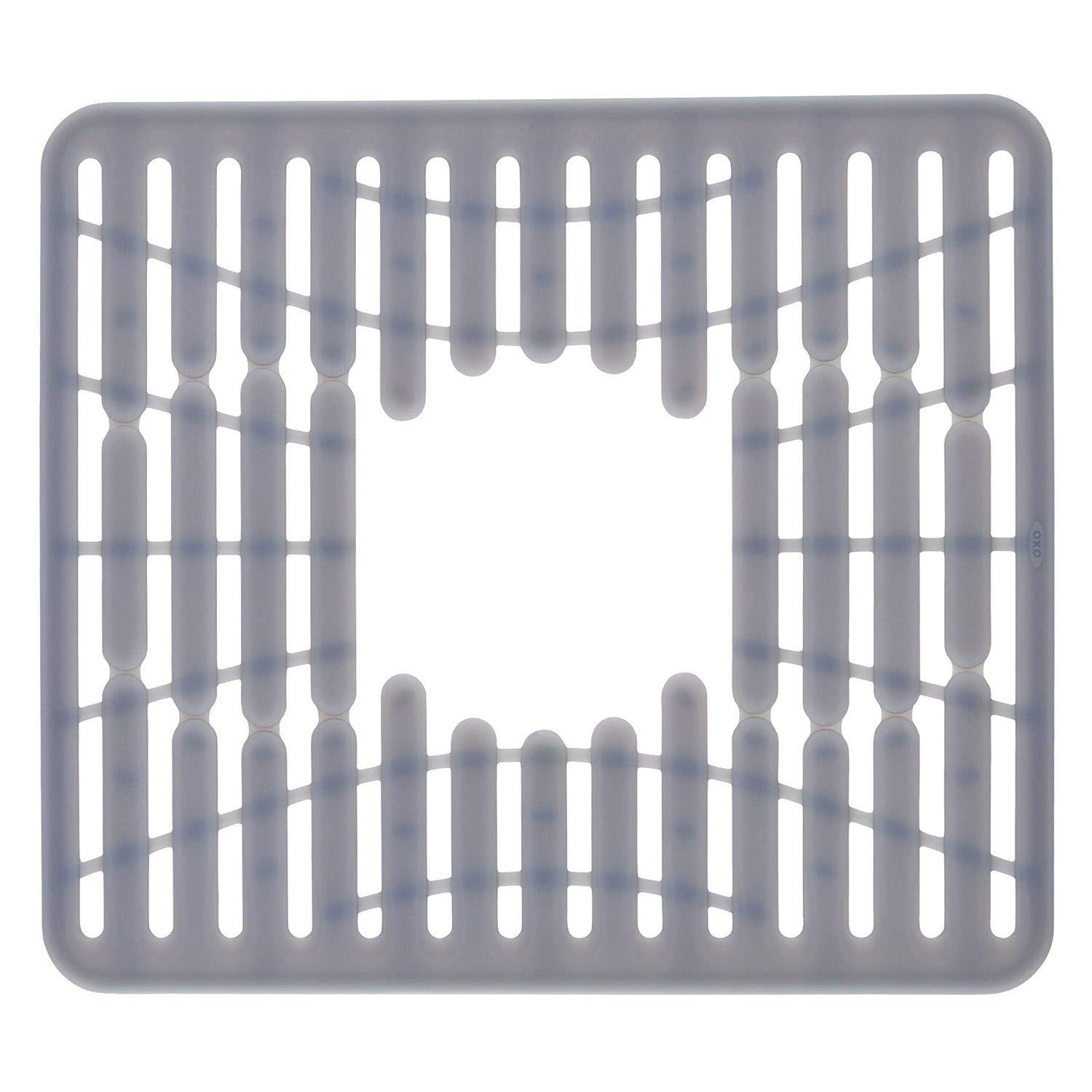 OXO Good Grips silicone sink mat in sink protecting glasses and dishes from scratches.