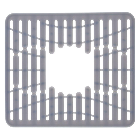 OXO Good Grips silicone sink mat in sink protecting glasses and dishes from scratches.