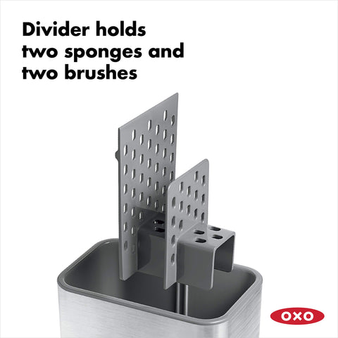 OXO Good Grips sinkware caddy with sponges and brushes neatly arranged for reach.