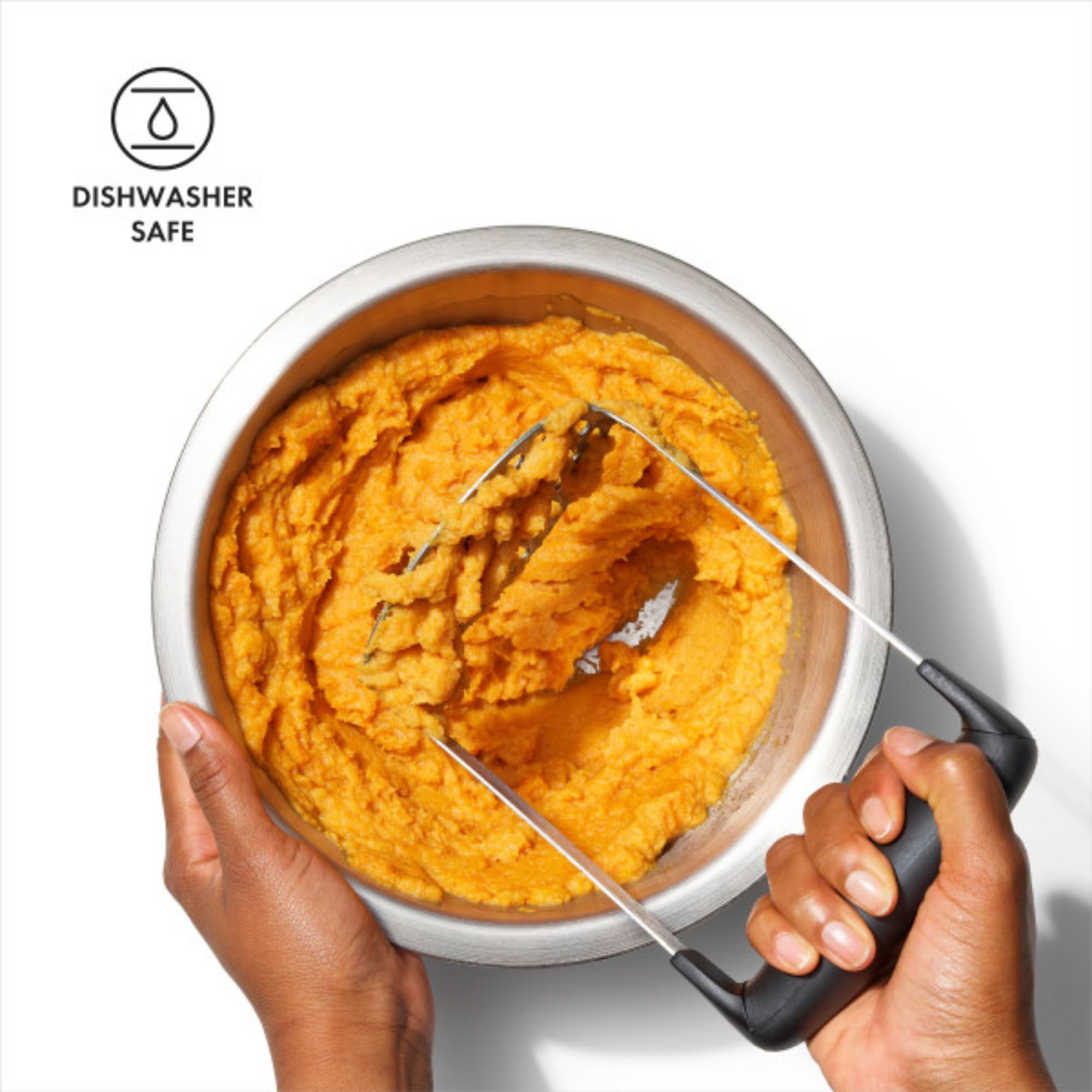 OXO Good Grips Smooth Potato Masher in action mashing potatoes in a bowl