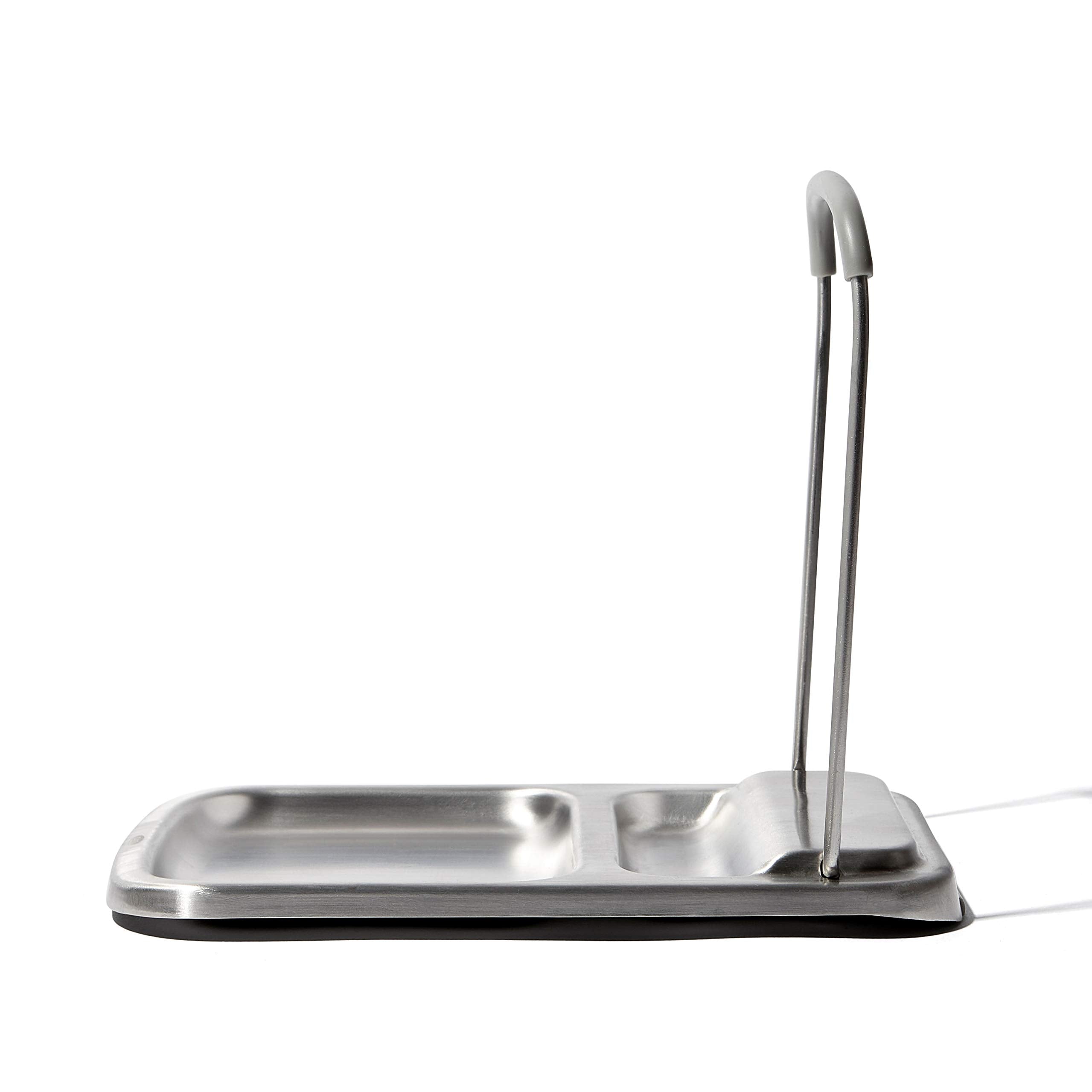 OXO Good Grips spoon rest with lid holder sits on the counter, simplifying cleanup.