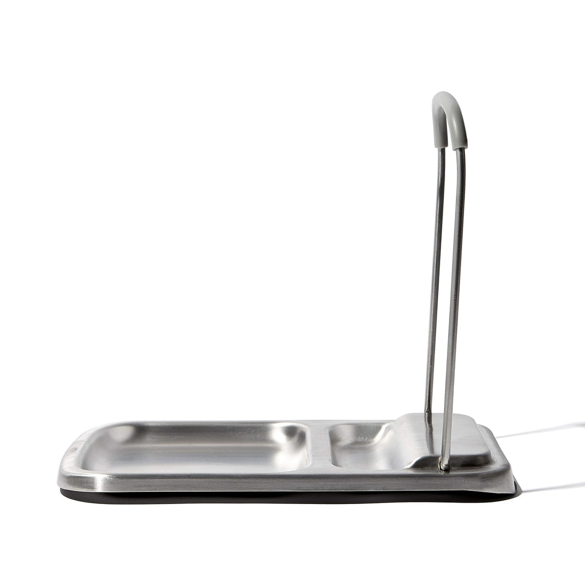 OXO Good Grips spoon rest with lid holder sits on the counter, simplifying cleanup.