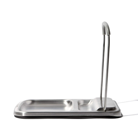 OXO Good Grips spoon rest with lid holder sits on the counter, simplifying cleanup.