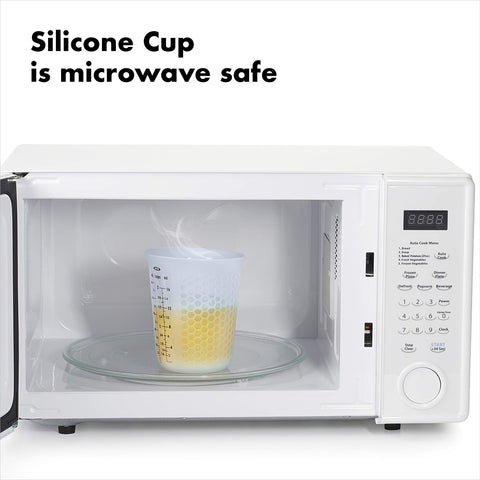 Hands holding OXO Good Grips cup from microwave with stay-cool exterior