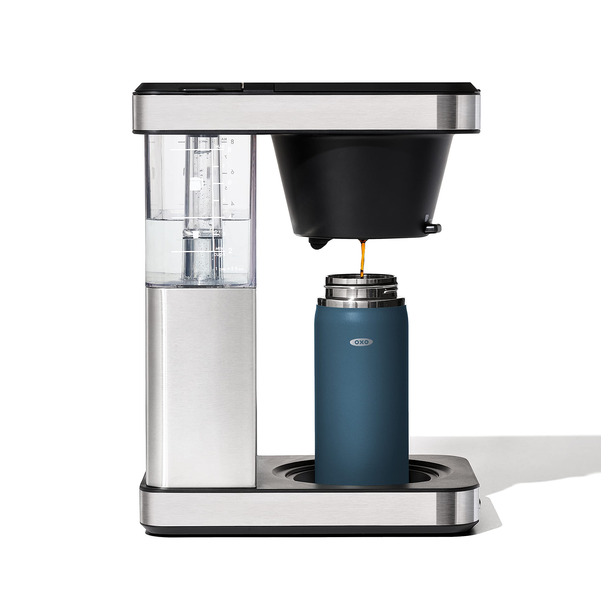 OXO Good Grips travel mug in action on the move with dark cobalt finish