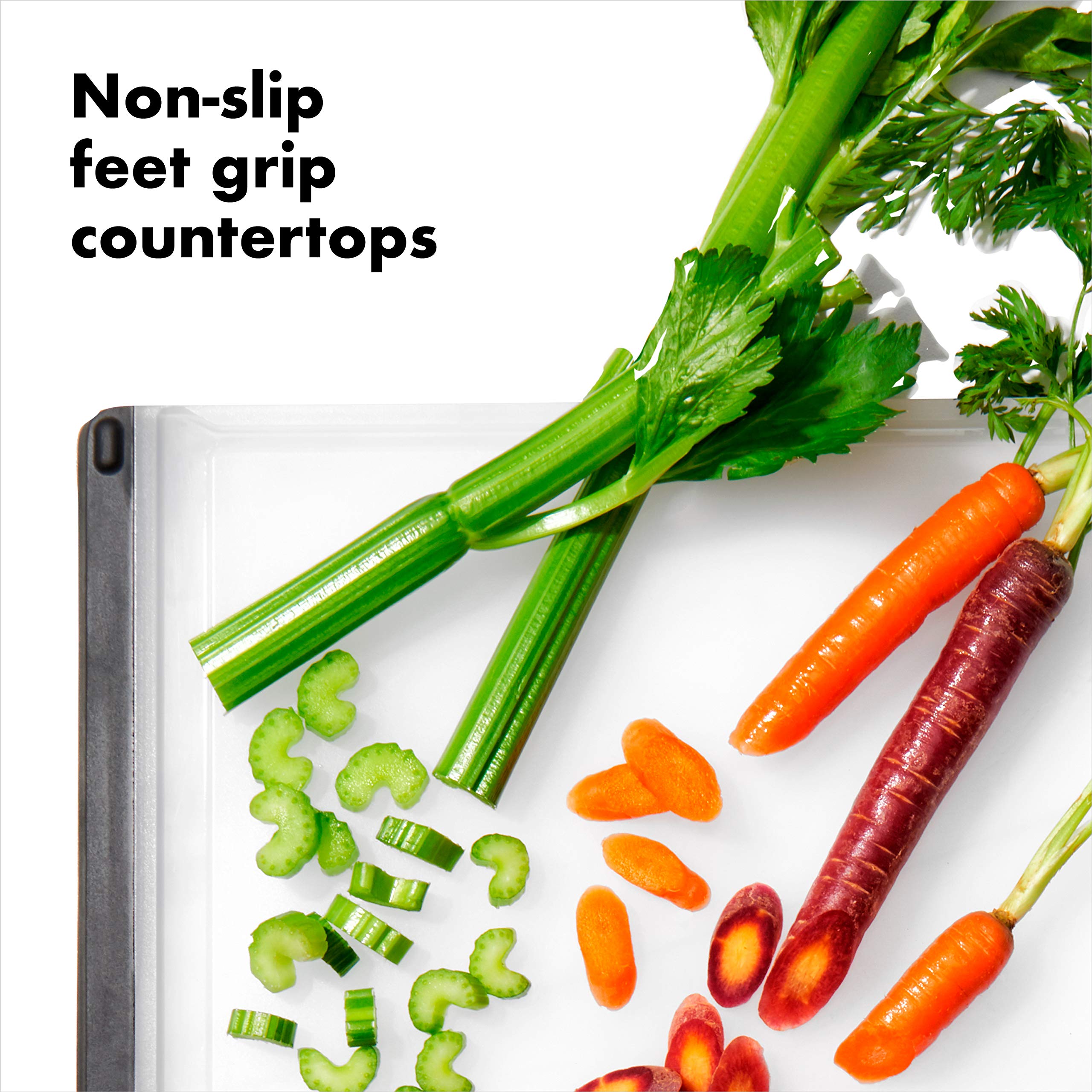 OXO Good Grips Cutting Board soft-edged handles offer comfortable lifting between tasks.