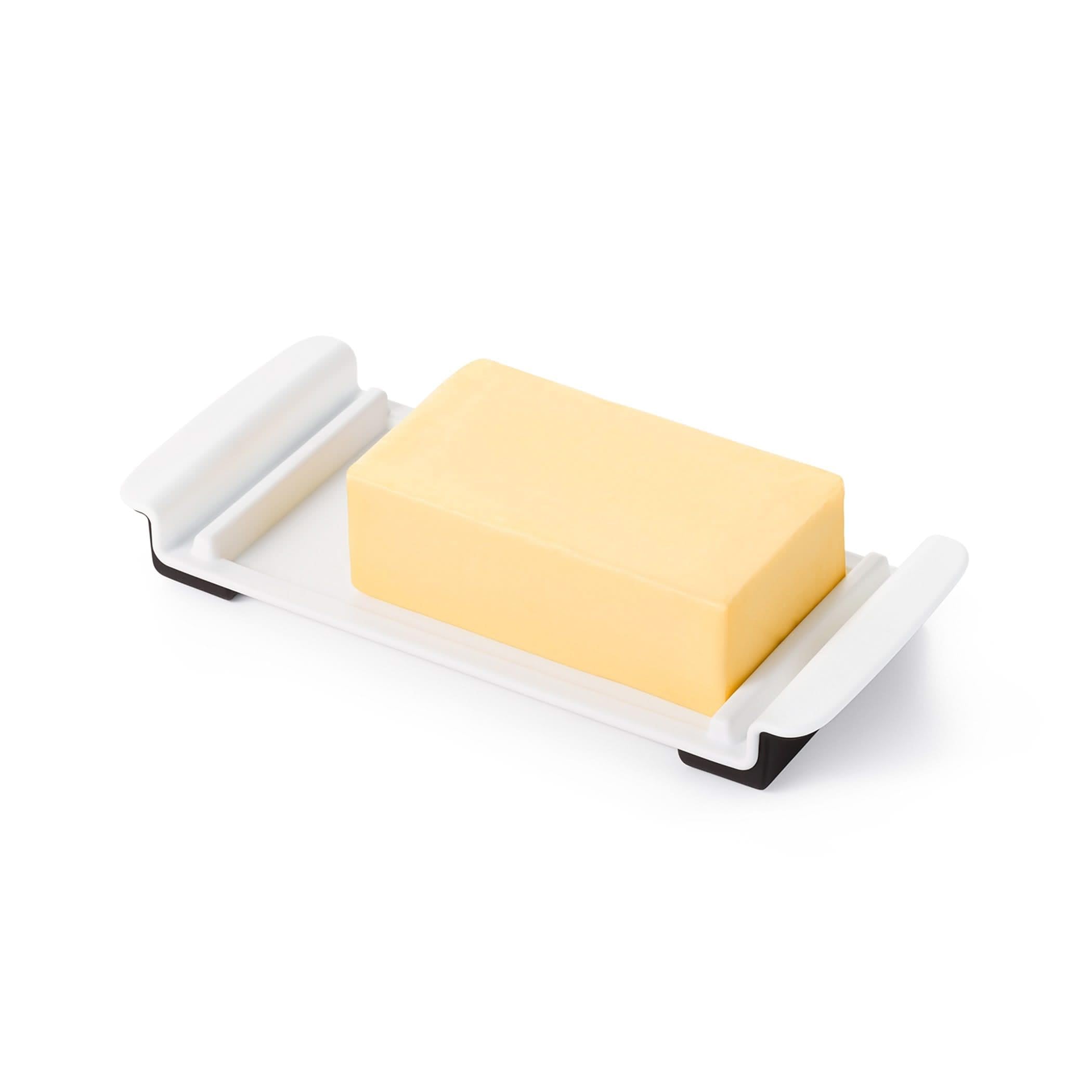OXO Good Grips Wide Butter Dish shows stoppers on sides prevents movement.
