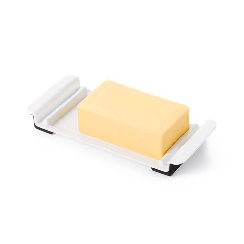 OXO Good Grips Wide Butter Dish shows stoppers on sides prevents movement.