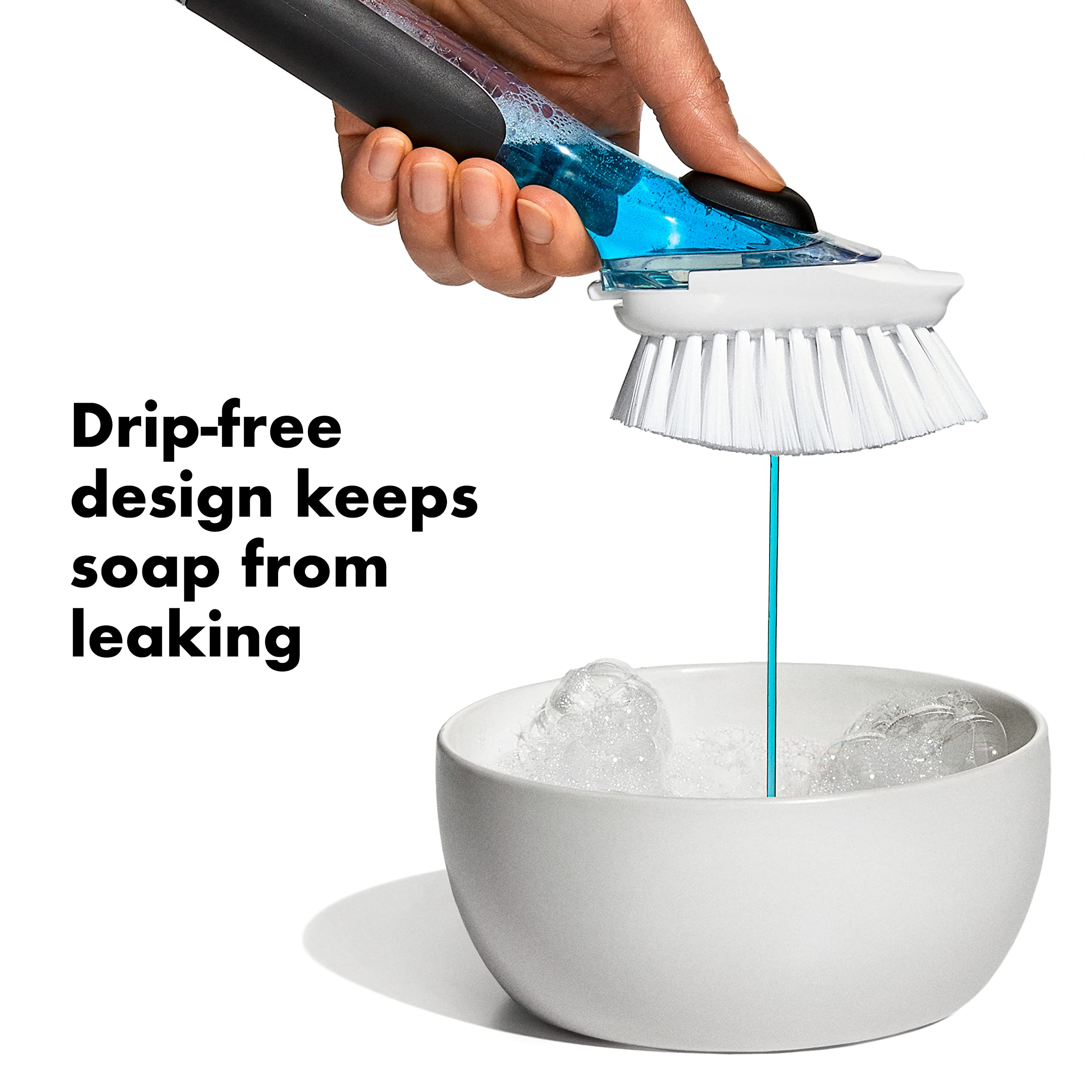 OXO New Good Grips dish brush button action demonstrates easy, controlled soap release.