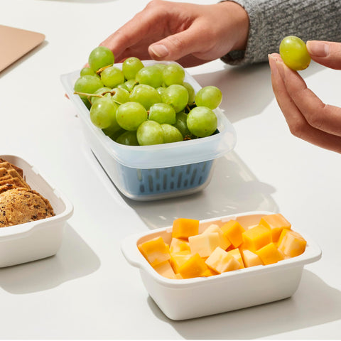 Stackable design saves fridge and cabinet space for snacks and meals.