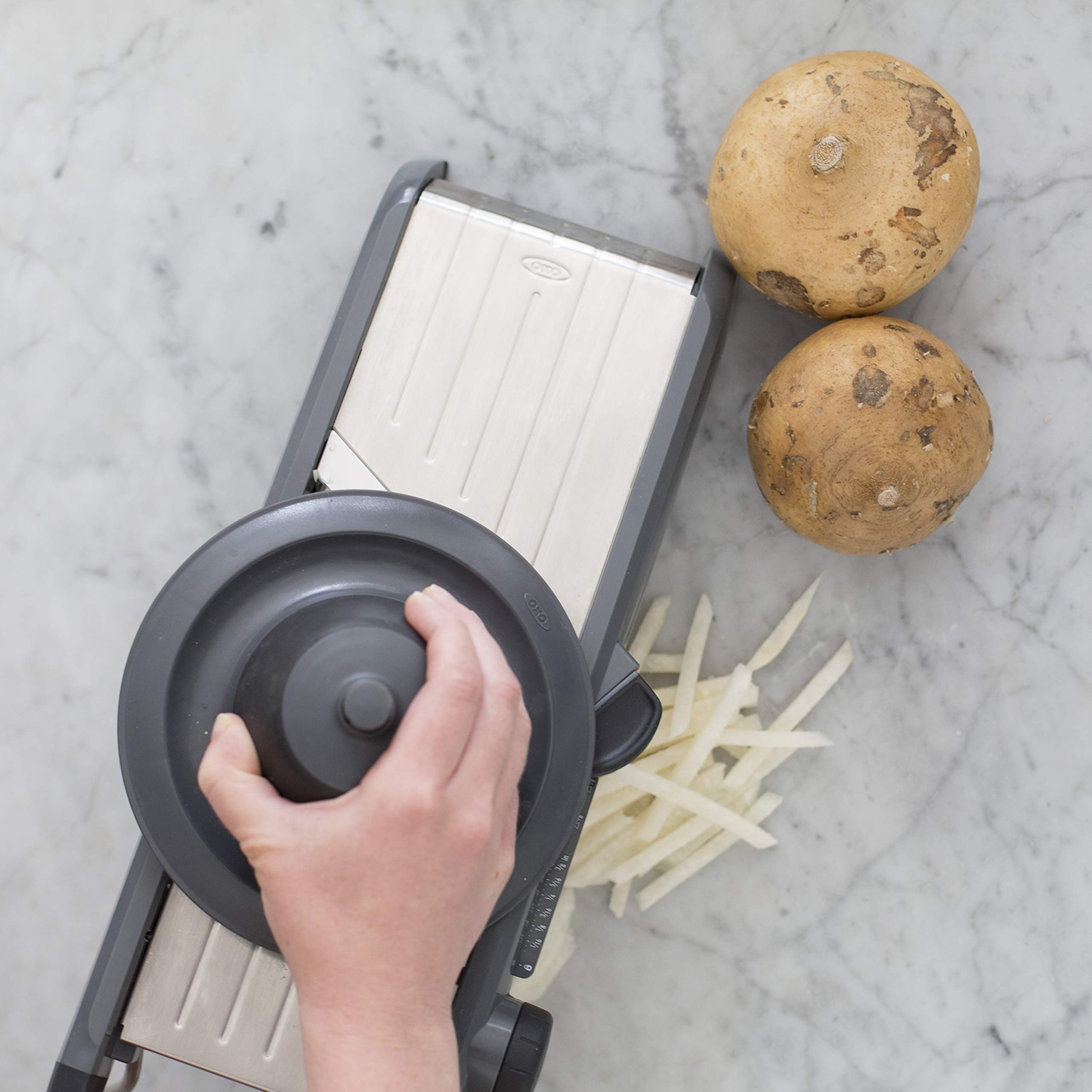 OXO SteeL Mandoline 2.0 blade assembly detail for versatile cuts.