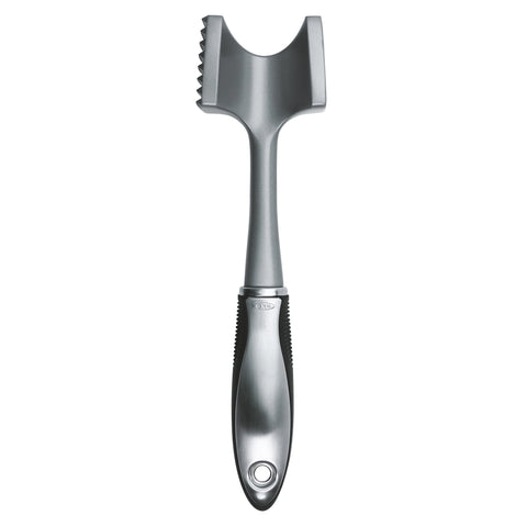 OXO SteeL meat tenderizer with a soft grip for controlled pounding.