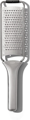 OXO Steel Grater creating chocolate shavings for desserts.