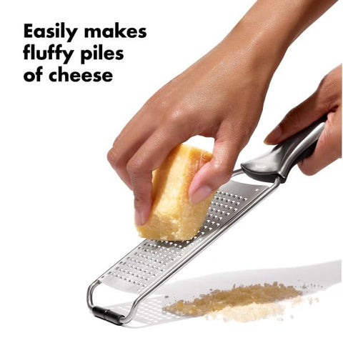 OXO Steel Grater used to zest lemon for fresh dressings.