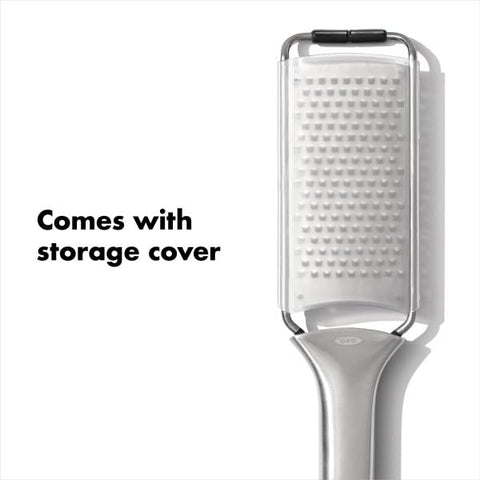 OXO Steel Grater with safety cover protecting blades during storage.