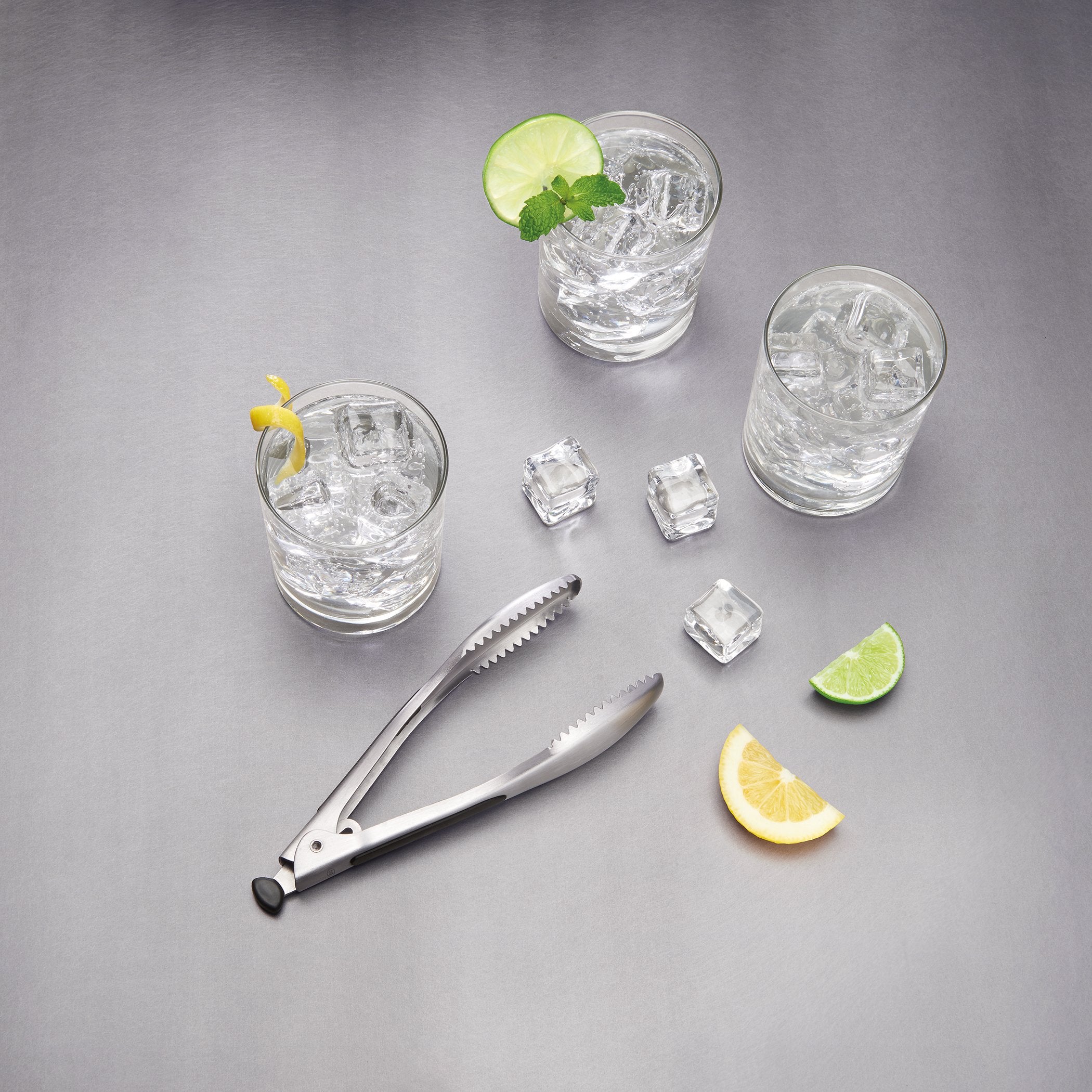 OXO SteeL ice bucket lid allows one-handed access and secure closure.