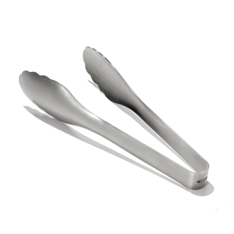 OXO Steel Serving Tongs close-up of scalloped head for added grip in tossing